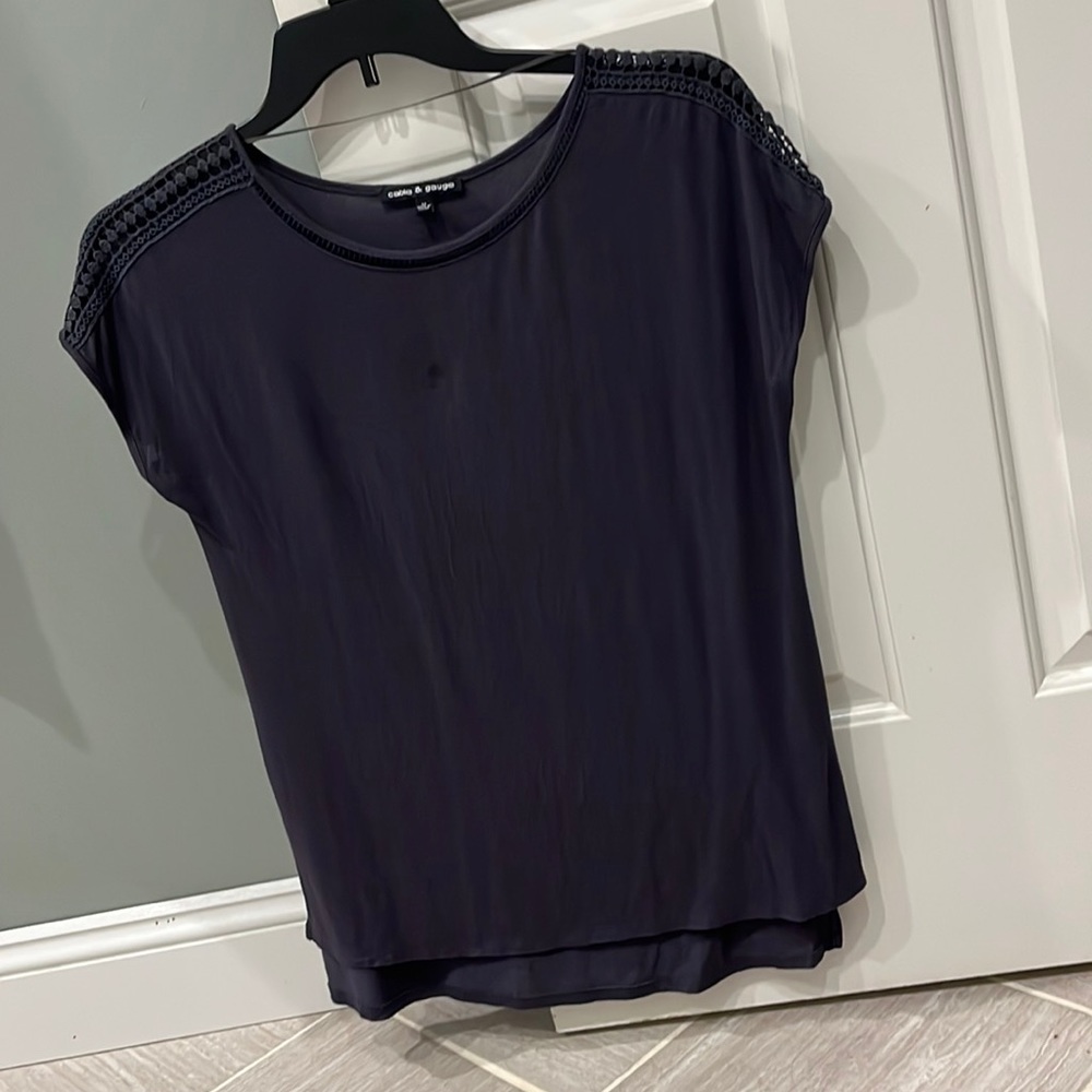 Gray blouse with decoration on shoulder and around neck